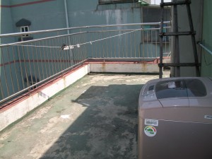 My rooftop patio and washing machine. No room for it inside. Fun in the winter!