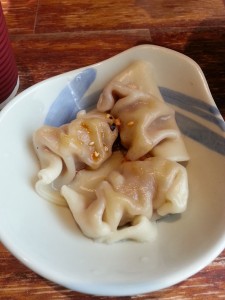 Hand-made Chinese dumplings, similar to mandu in Korea or pierogis in Poland.