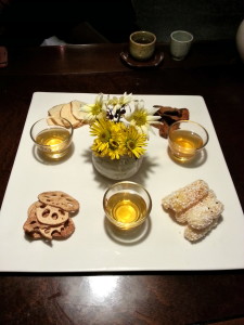 Dessert of dried lotus root, potatoes, sweet potatoes and sweet puffed rice fingers with a cinnamon tea. 
