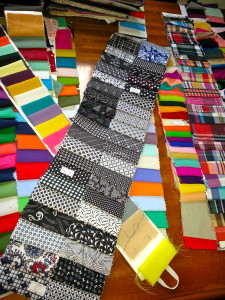 Fabric swatches cover the desk of our homestay owner, Moon.