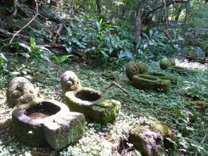 Replicas of ancient stone basins with turtle heads and fish tails. 