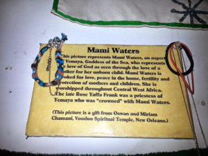 Offerings left to Mami Waters, called upon for peace, love, protection of the home and of mothers and children.